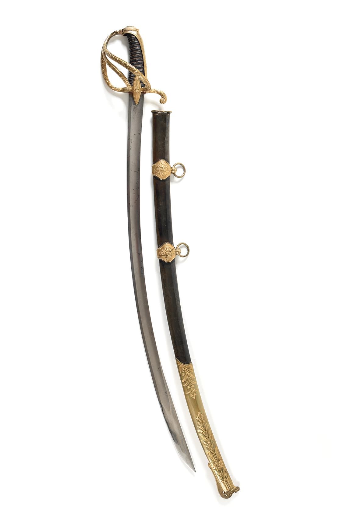 Null 轻骑兵军官的军刀。 
被称为 "à la chasseur "的镀金黄铜支架，带有长裙边的帽子。三棱形刀柄和两个梭形刀柄上凿有花朵、叶子、卷轴和菱形。&hellip;