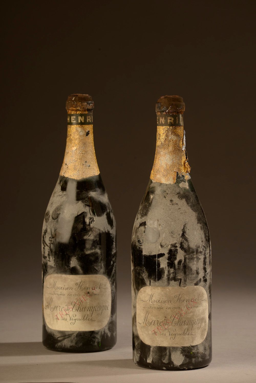 Null 2 bottles MARC DE CHAMPAGNE, Henriot (very old, torn cap)