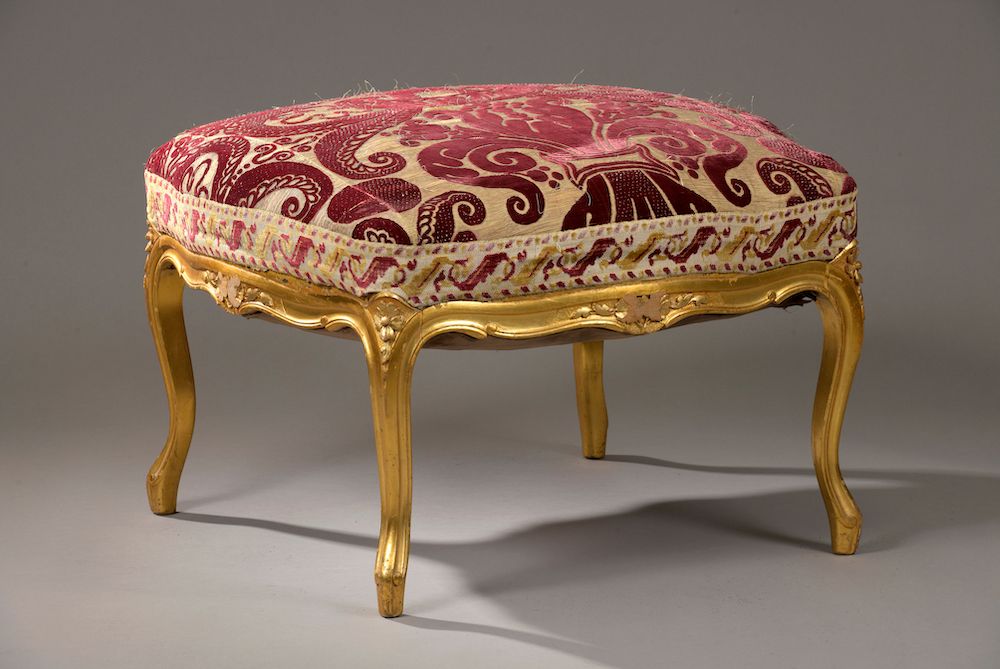 Null A large square stool in moulded, carved and gilded wood, the belt decorated&hellip;
