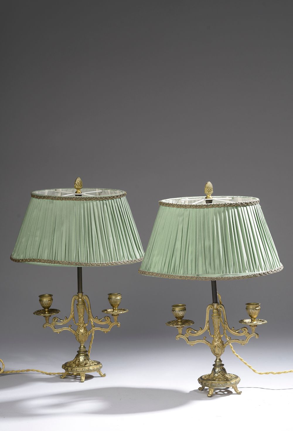 Null A pair of gilt bronze candlesticks with two scrolled lights. It rests on a &hellip;