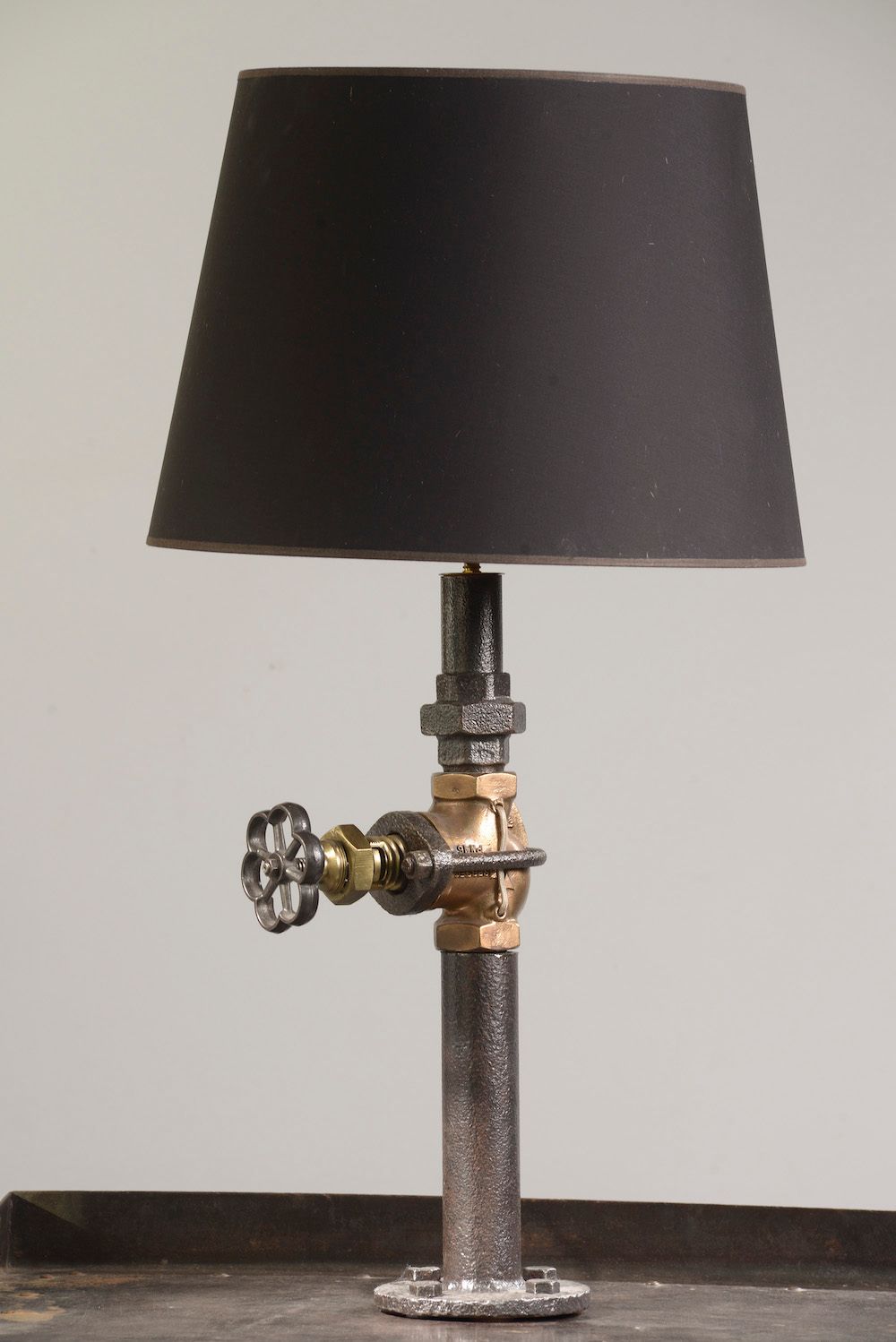 Null Table lamp in the industrial style, the shaft formed by a patinated metal p&hellip;