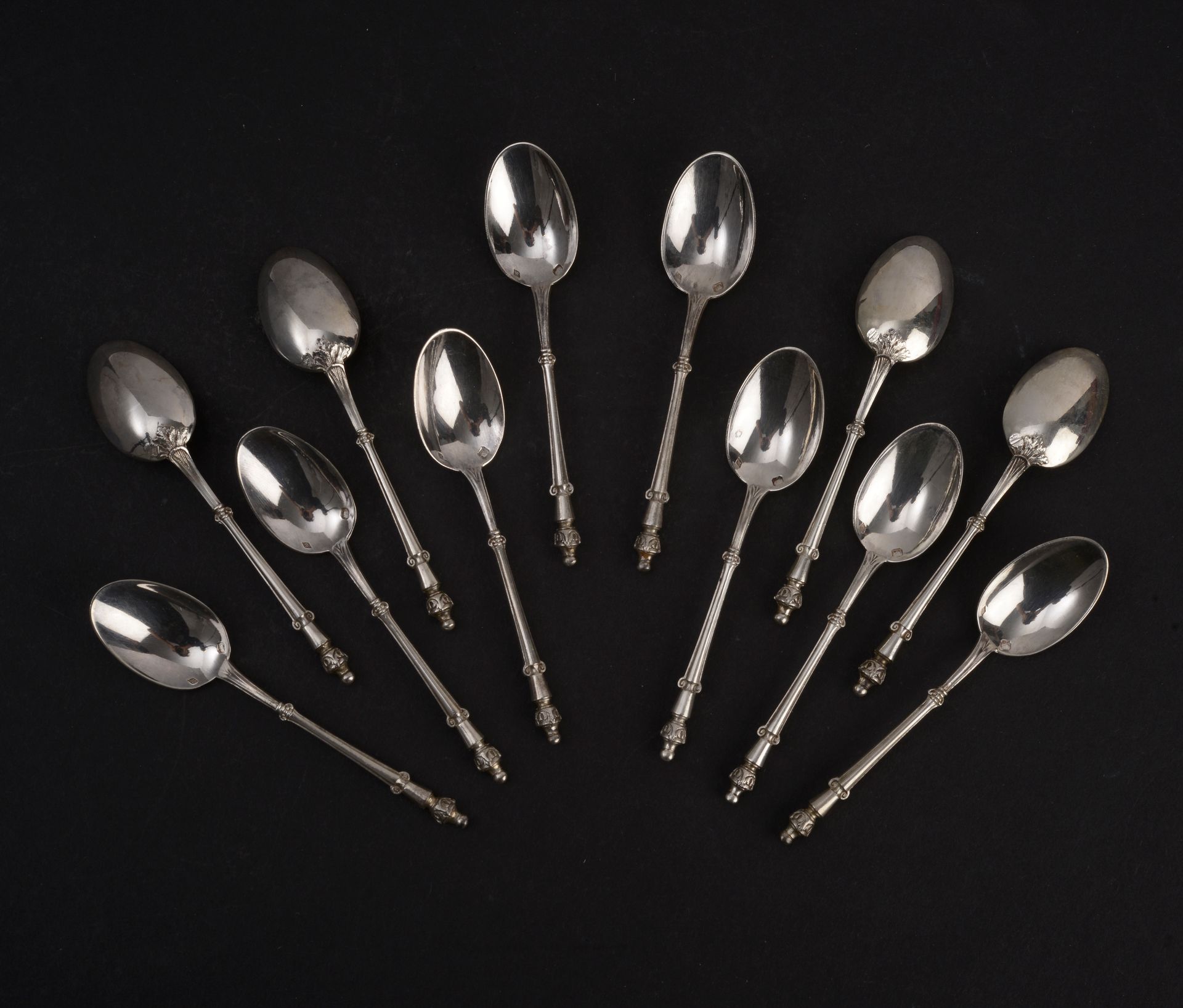 Null Set of twelve small silver mocha spoons, the handle formed by an ionic colu&hellip;