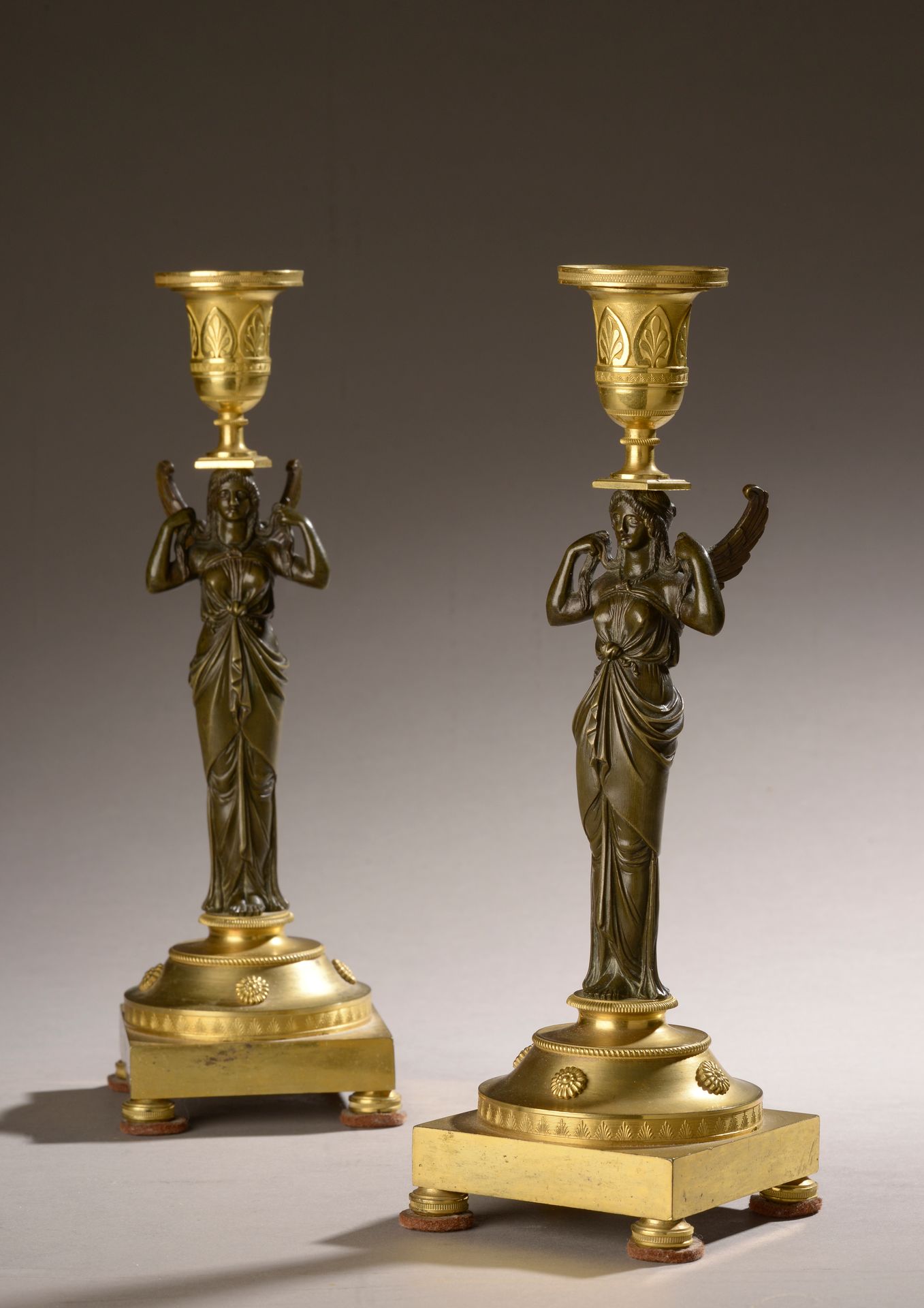 Null Pair of candlesticks, the ormolu base decorated with a frieze of palmettes,&hellip;