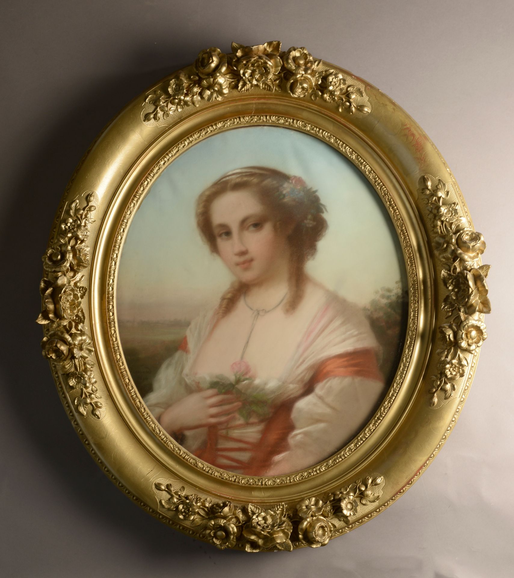 Null École française vers 1870. 
Jeune femme à la rose.
Pastel ovale sur papier &hellip;