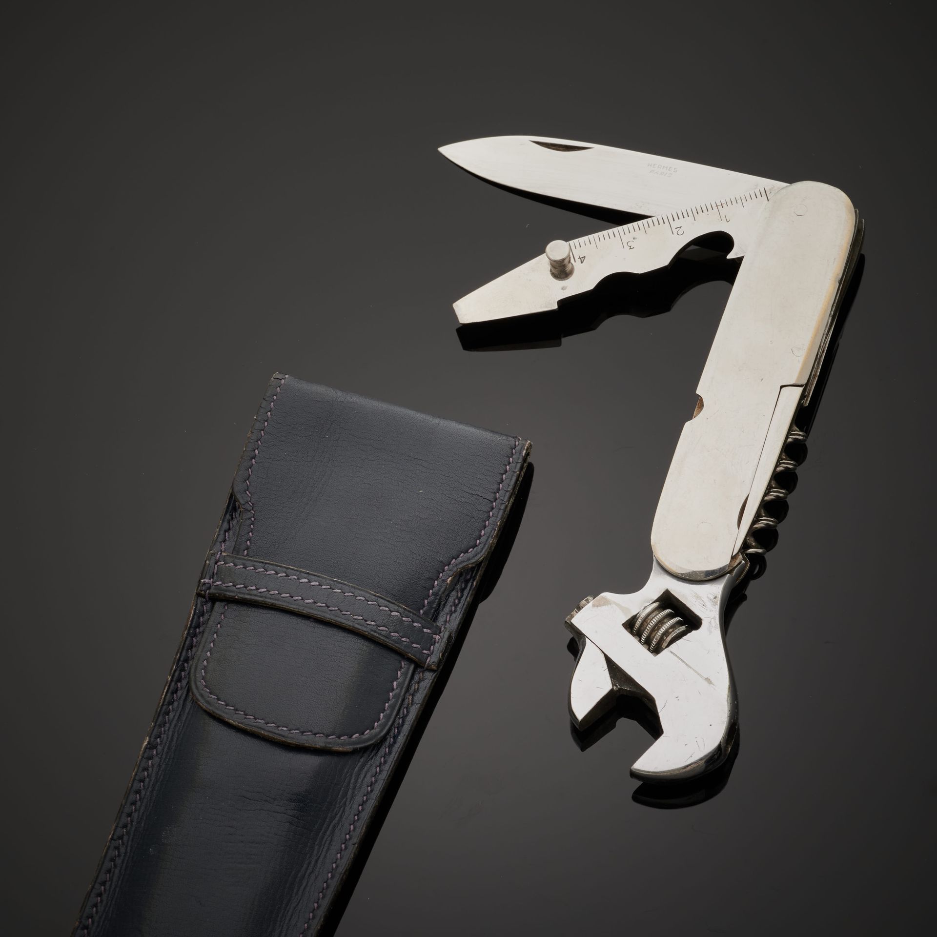 Null HERMÈS.
Swiss" type knife in silver plated metal (slight wear) : wrench, co&hellip;