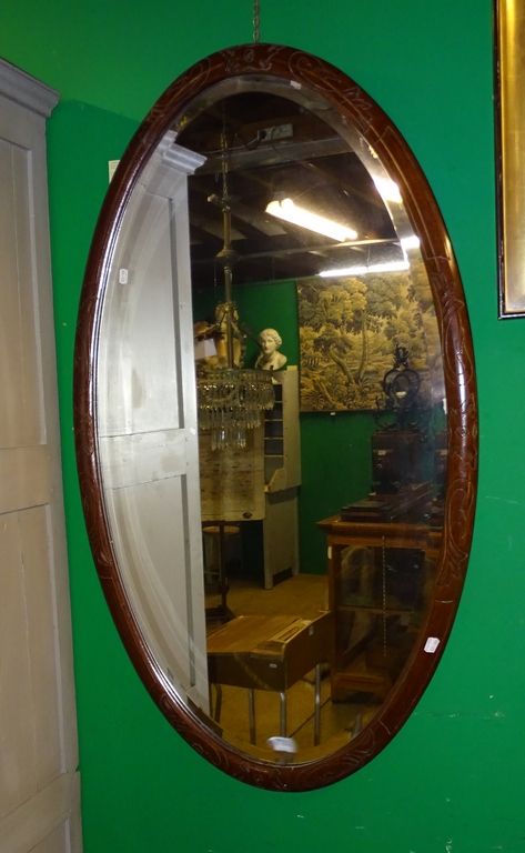 Null Piece of furniture: Large oval mirror in carved wood with bevelled glass 12&hellip;