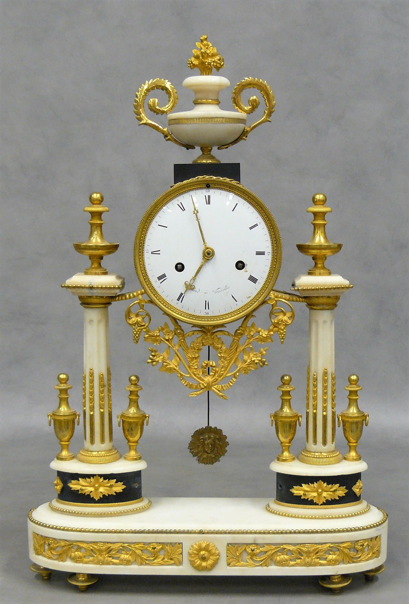 THIABAUD A Louis XVI ormolu and white marble portico clock, surmounted by a flow&hellip;