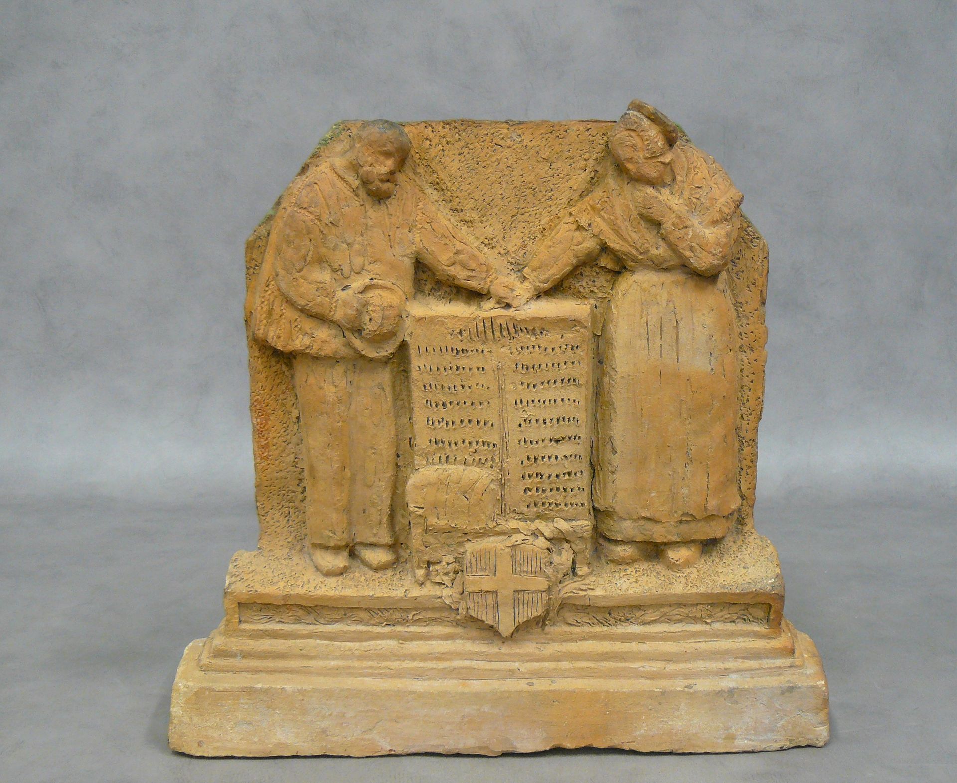 Null a project of stele in terra cotta, couple of Savoyards meditating; the base&hellip;