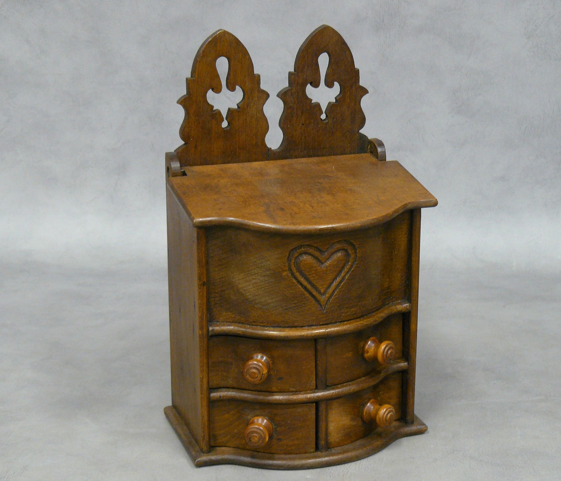 Null a spice box with a curved front decorated with a heart opening by four draw&hellip;