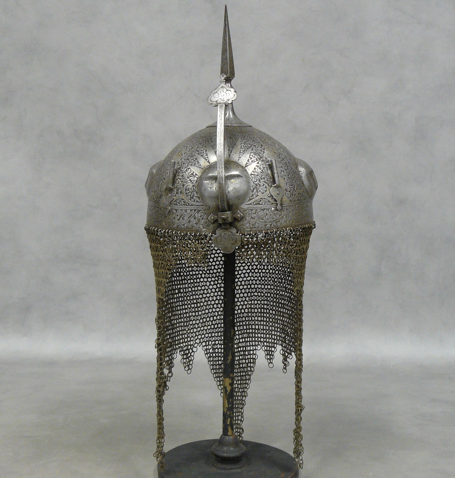 Null a Persian or Ottoman kulah-kud helmet, iron bomb decorated with four faces &hellip;