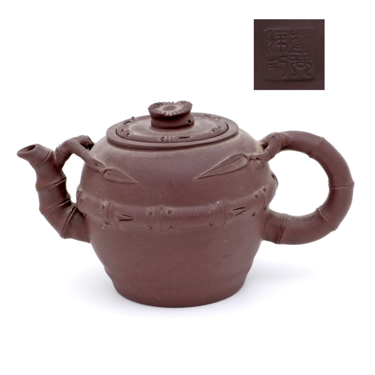 A Yixing teapot A YIXING TEAPOT Chinese terracotta, brown monochrome decoration,&hellip;