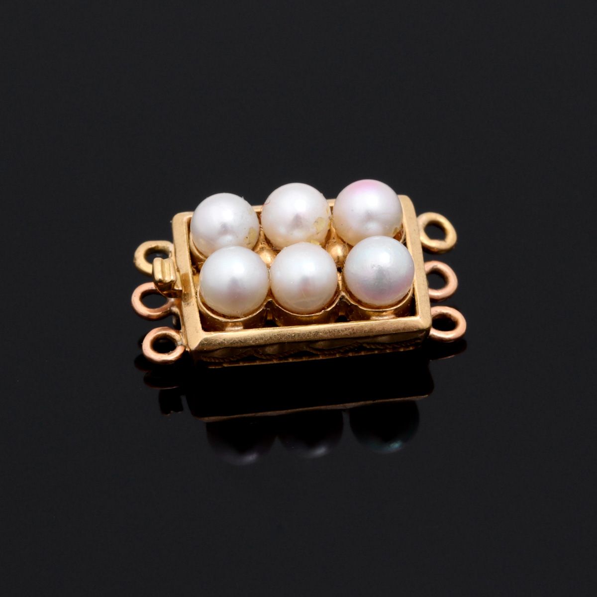 A CLASP A CLASP 800/000 gold, applied with six cultured pearls, Porto assay mark&hellip;