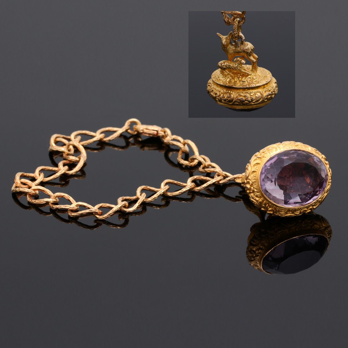 A bracelet A BRACELET 800/000 gold, pendant with goats, set with amethyst, Lisbo&hellip;