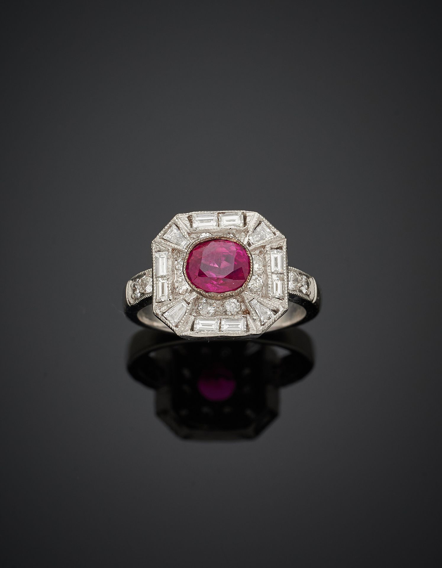 Null White gold (750‰) octagonal ring set with an oval-shaped ruby, surrounded b&hellip;