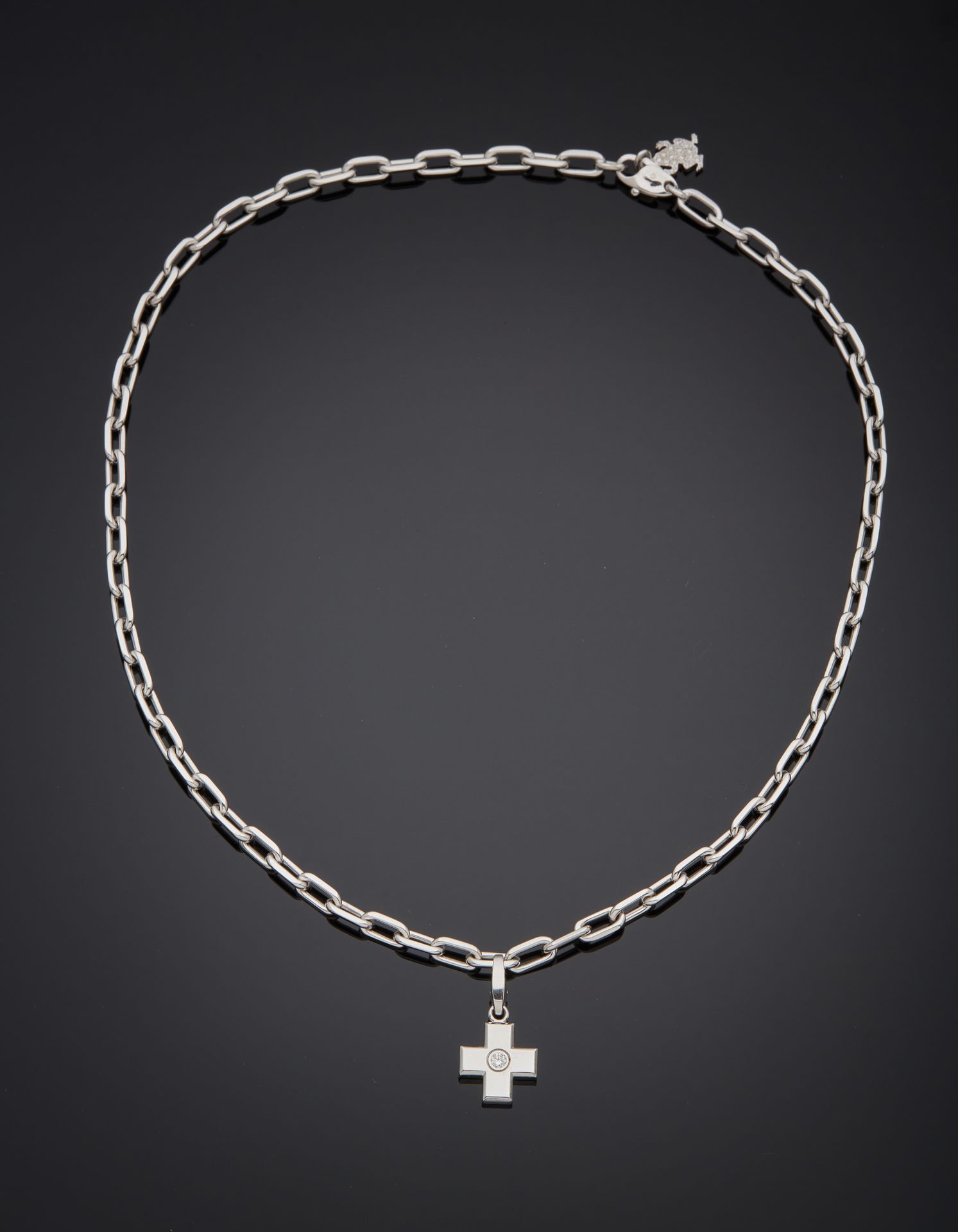 CARTIER "Cross" PENDANT and its oval-link CHAIN, in white gold (750‰) centered w&hellip;