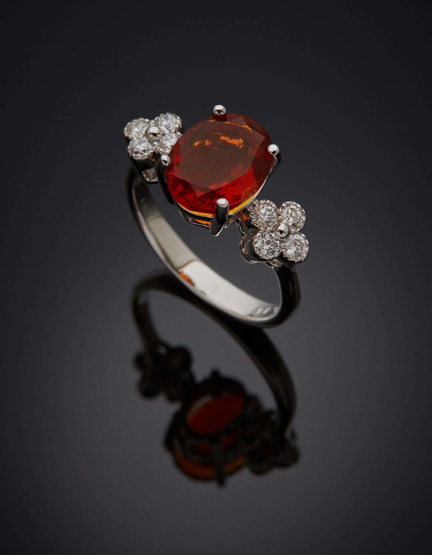 Null White gold ring (750‰) adorned with an oval-shaped fire opal, shouldered by&hellip;