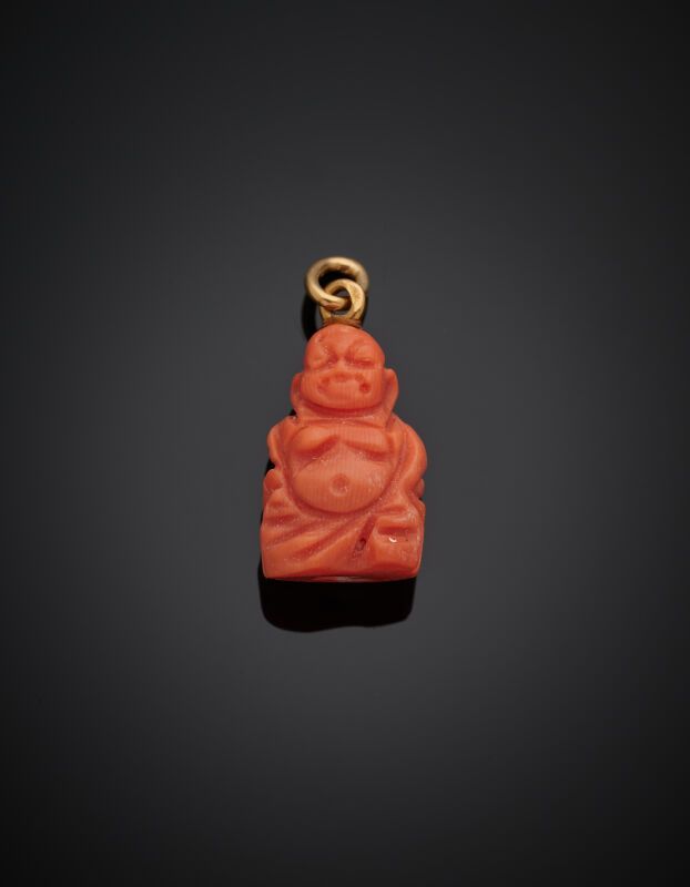 Null Carved coral belloque featuring a Buddha, the setting in yellow gold (750‰)&hellip;