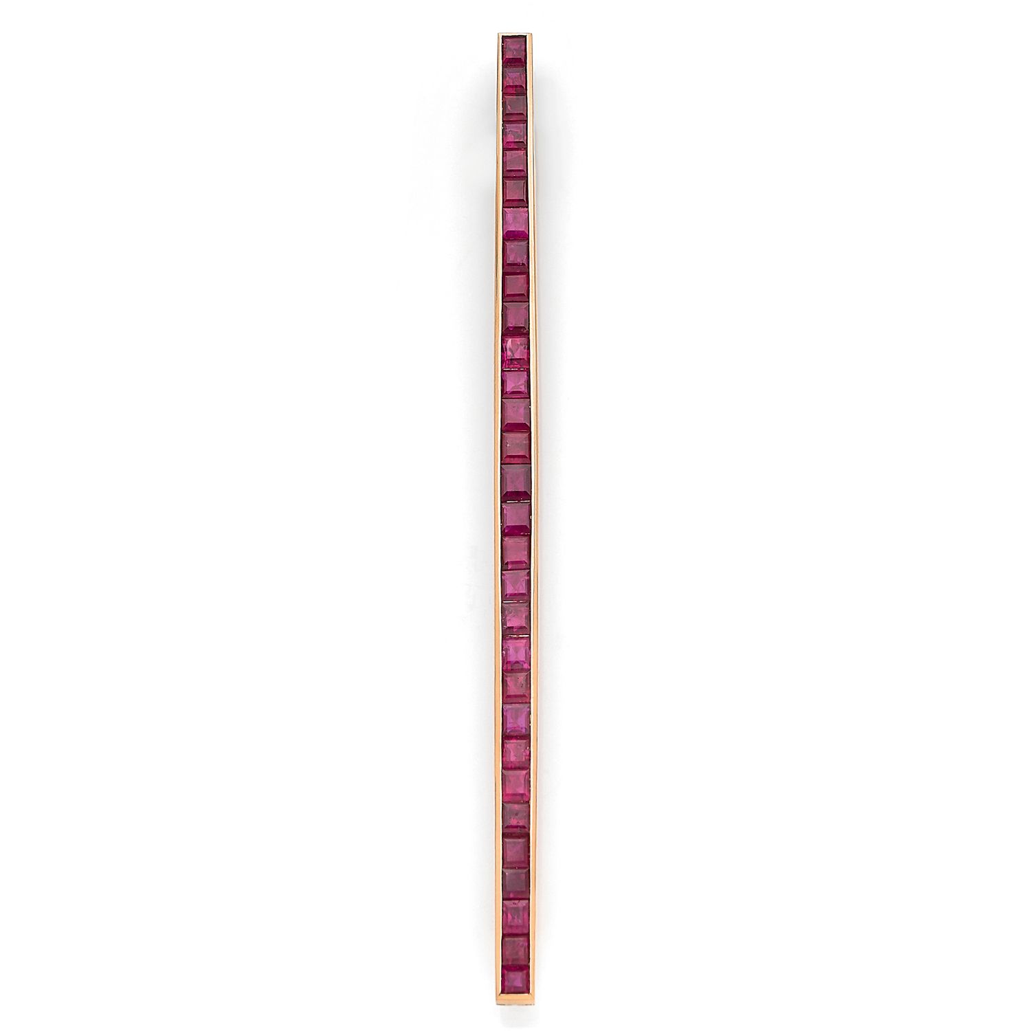 Null 18K（750‰）黄金发夹胸针，镶嵌着一排大小不等的校准红宝石

1935-40年的法国作品

长度：11厘米

毛重：14.2克