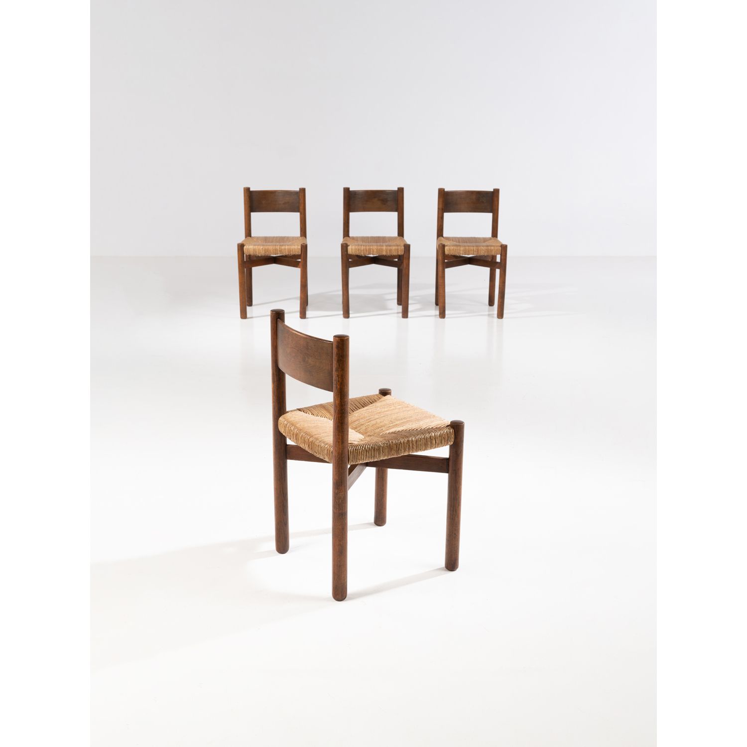 Null Charlotte Perriand (1903-1999)

Méribel

Set of four chairs

Tinted oak woo&hellip;