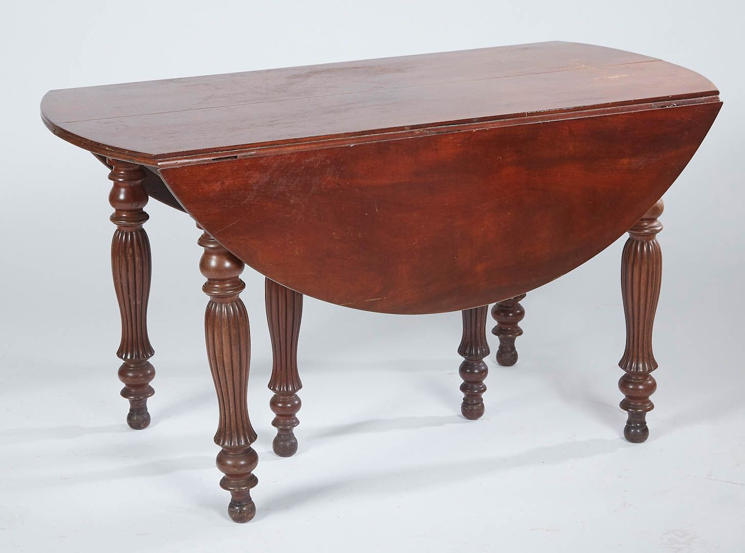 Null Round mahogany table with flaps resting on six legs called "umbrella". Loui&hellip;
