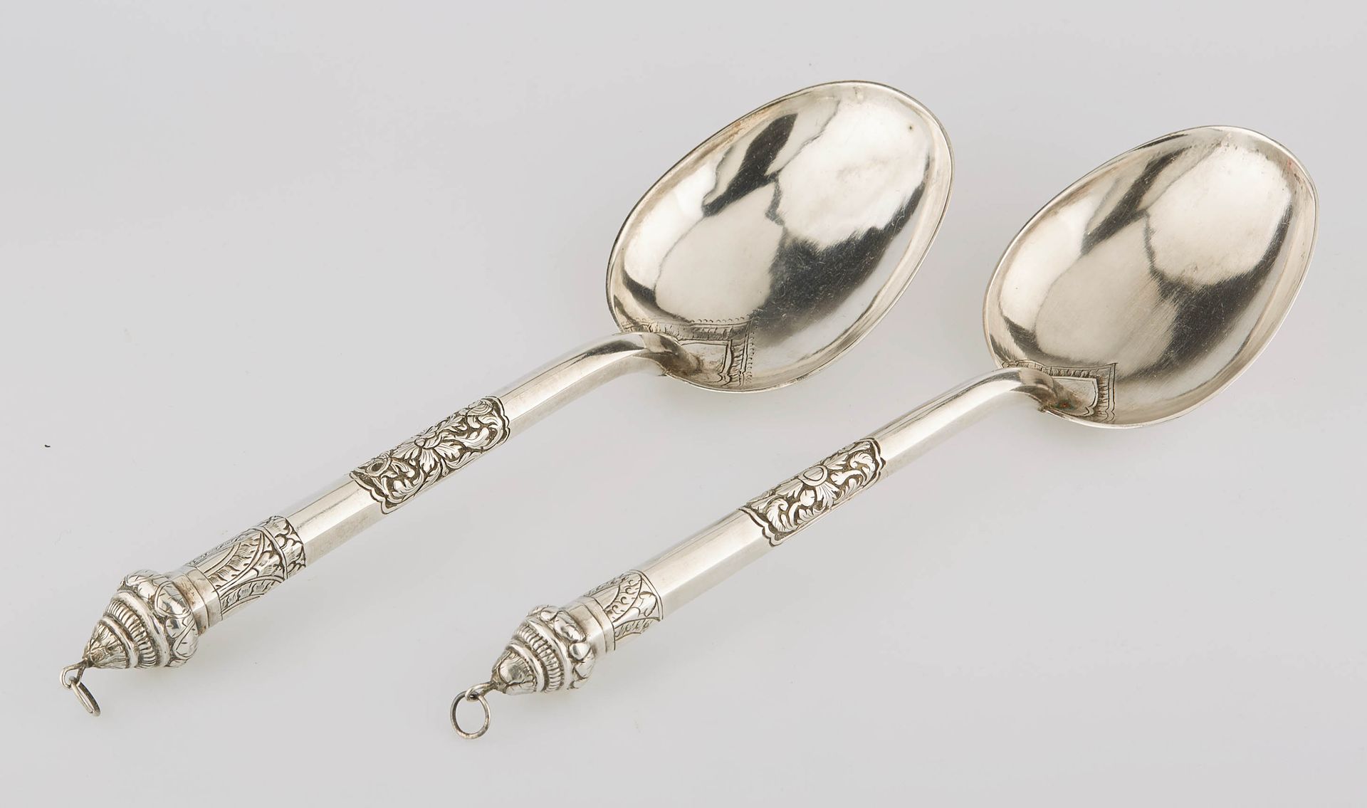 Null Asia. Two large silver spoons engraved and chased with foliage. Length : 24&hellip;