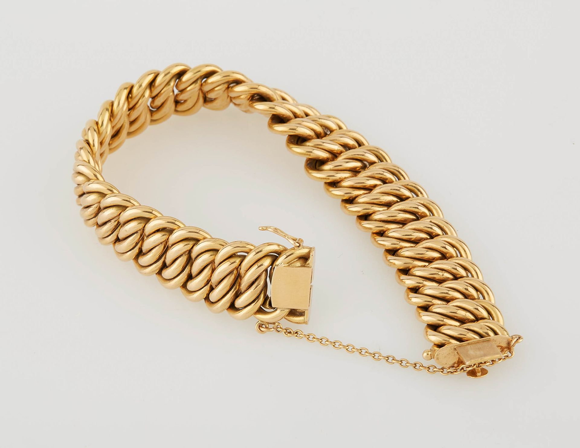 Null Flexible bracelet in yellow gold with safety chain. Width : 1,5 cm. Weight &hellip;