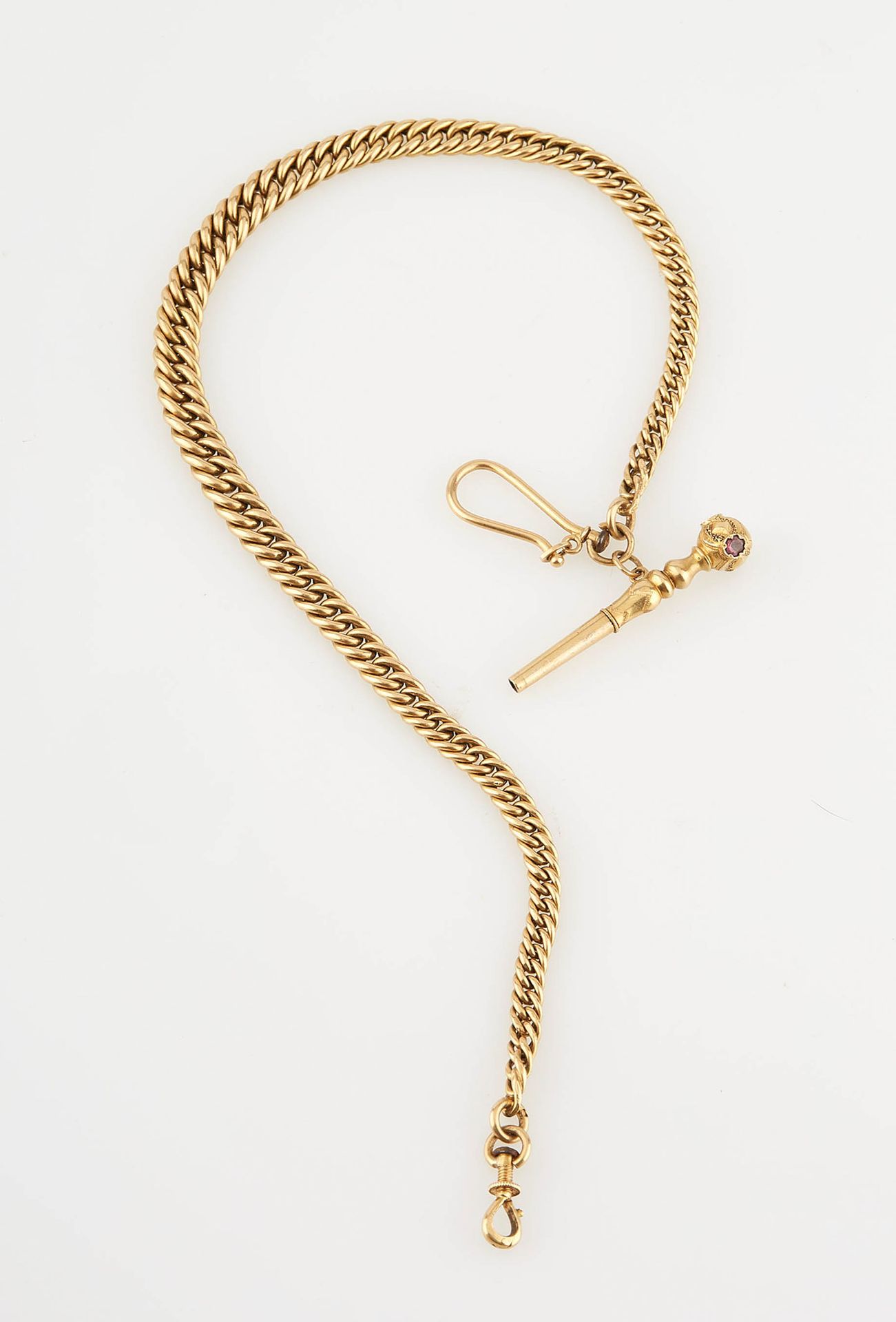 Null Yellow gold watch chain with a key. Length : 27 cm. Weight : 14,50 g.