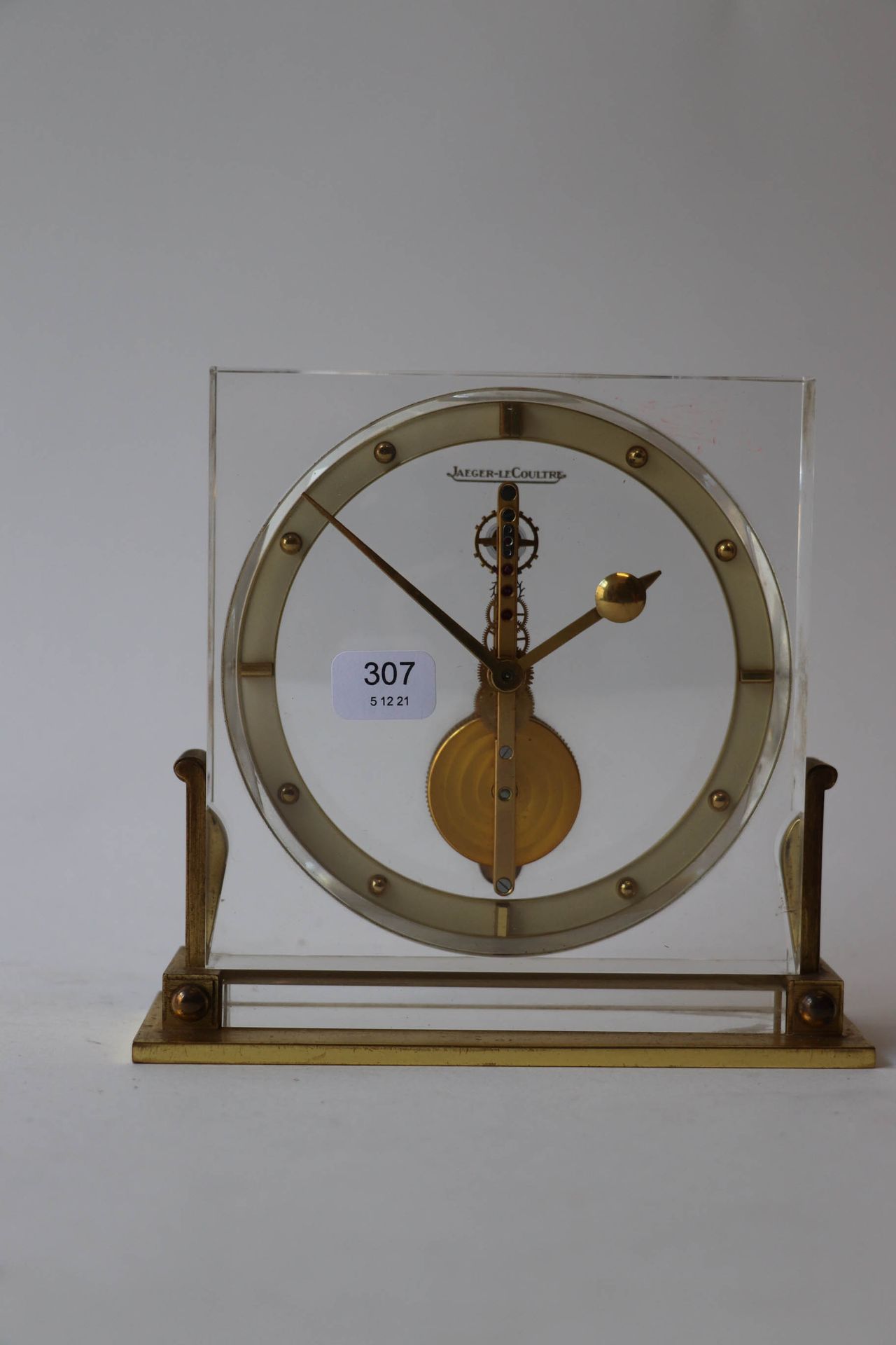 Null JAEGER-LECOULTRE. Small gilt metal and plexiglass skeleton clock. Signed. H&hellip;