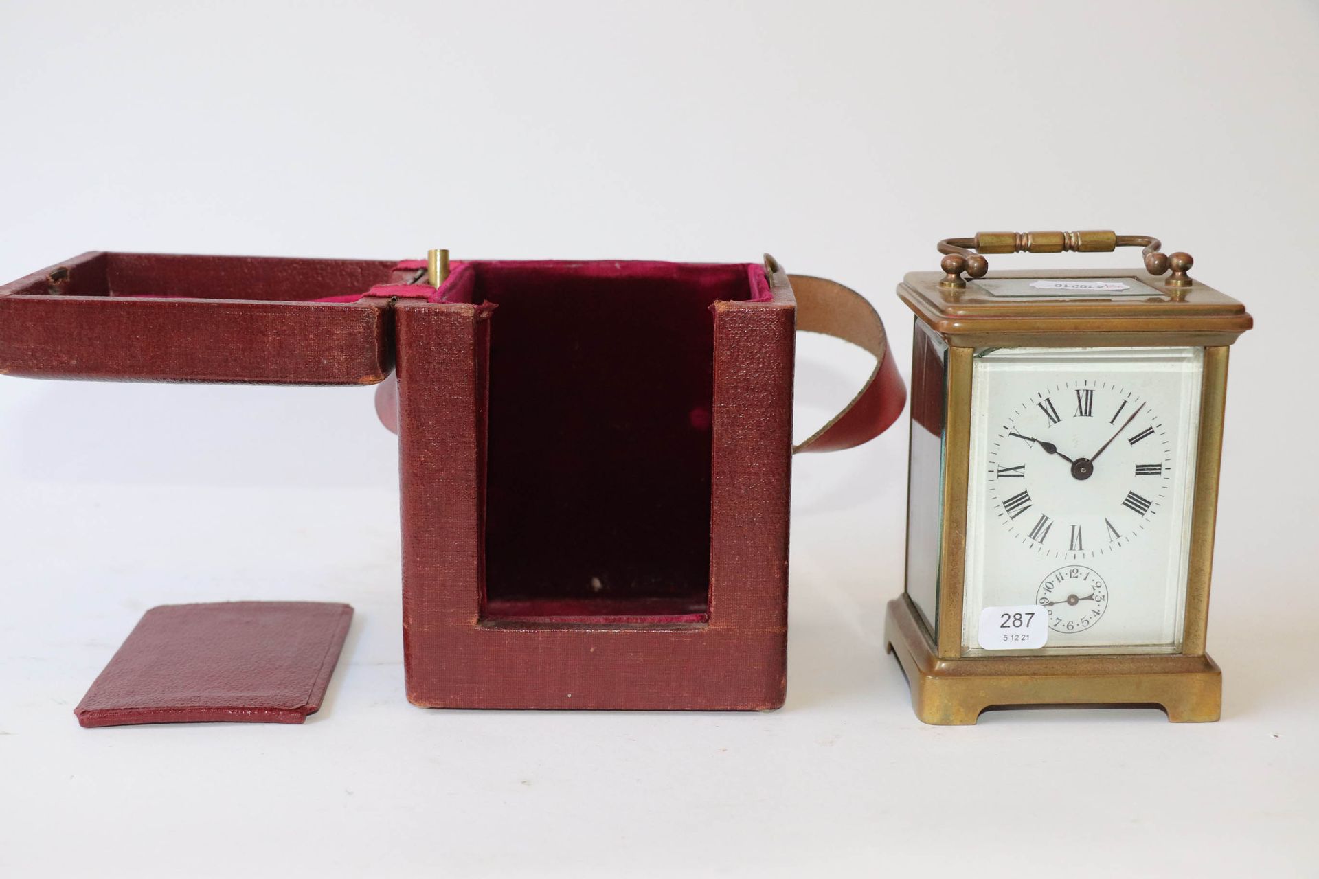 Null Brass and glass panel officer's alarm clock presented in its red leather ca&hellip;