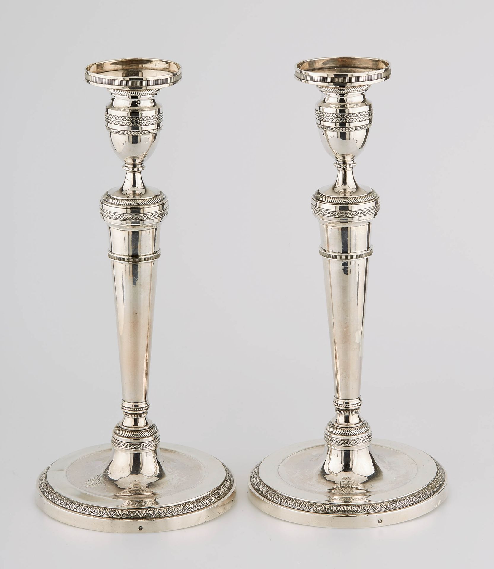 Null A pair of silver torches with a round base moulded with palmettes, cylindri&hellip;