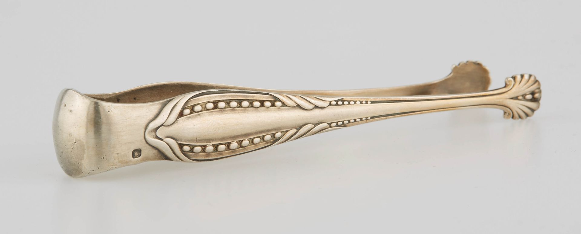 Null Silver sugar tongs engraved and chased with shells. Art deco style. Minerve&hellip;