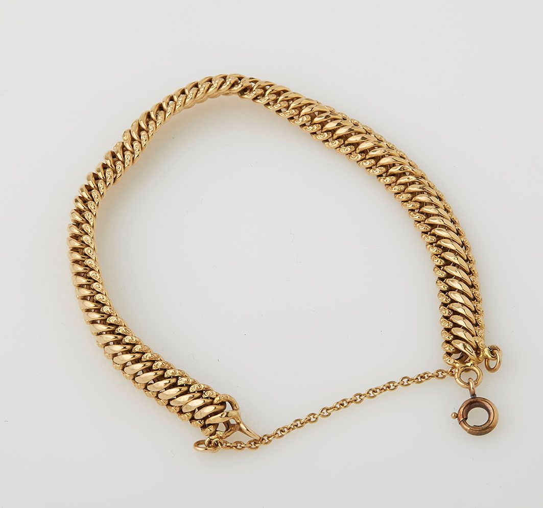 Null Flexible bracelet in yellow gold (18 K) with safety chain. Weight : 7,74 g.