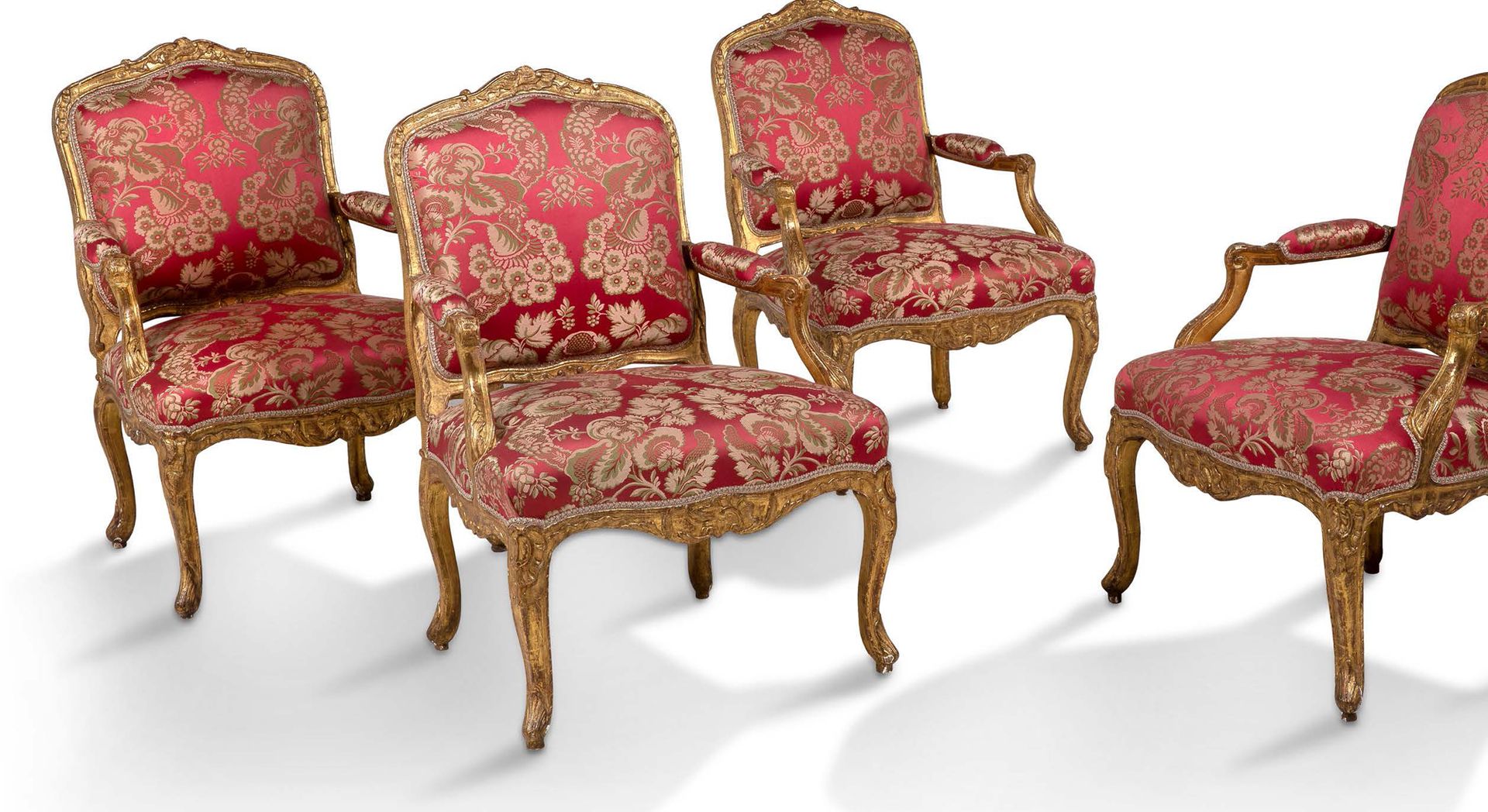 Null SET OF SIX moulded, carved and gilded beechwood armchairs, decorated with r&hellip;