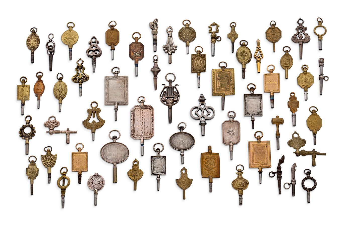 Null 
一套钟表钥匙



19世纪



一套大小不一的风格化钟表钥匙，主要用于钥匙上的手表。