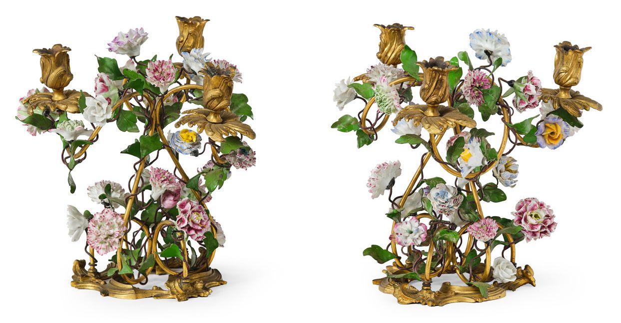 Null 一对三灯带凹槽的青铜和鎏金青铜烛台，带多色瓷花。路易十五时期。
高度：27厘米（小的事故和缺失的部分）。