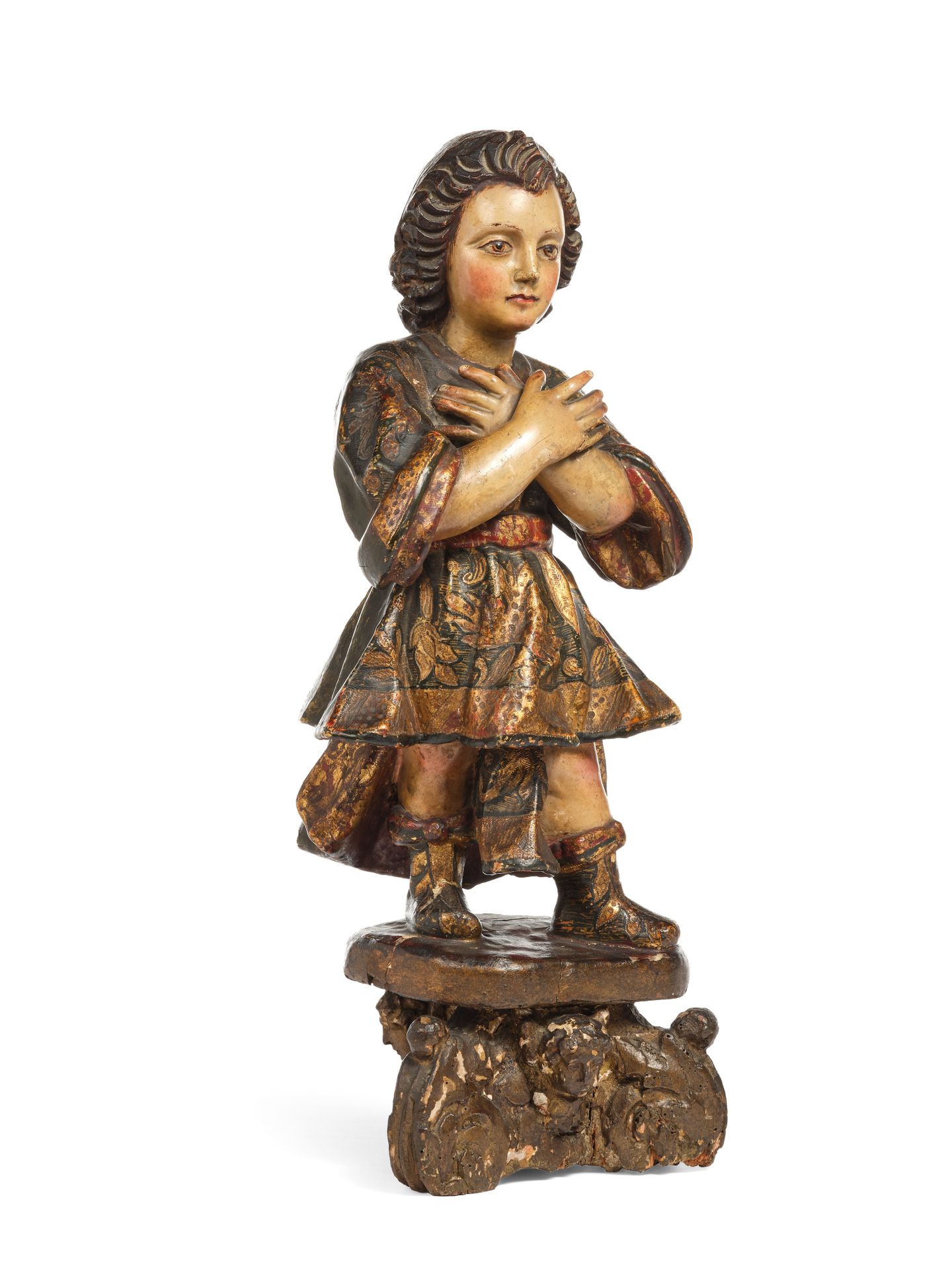 Null 圣天使崇拜者，木雕和彩绘，手臂交叉在胸前，南美洲，18世纪，在一个雕刻的三脚架底座上。
高度：42厘米
(翅膀丢失)