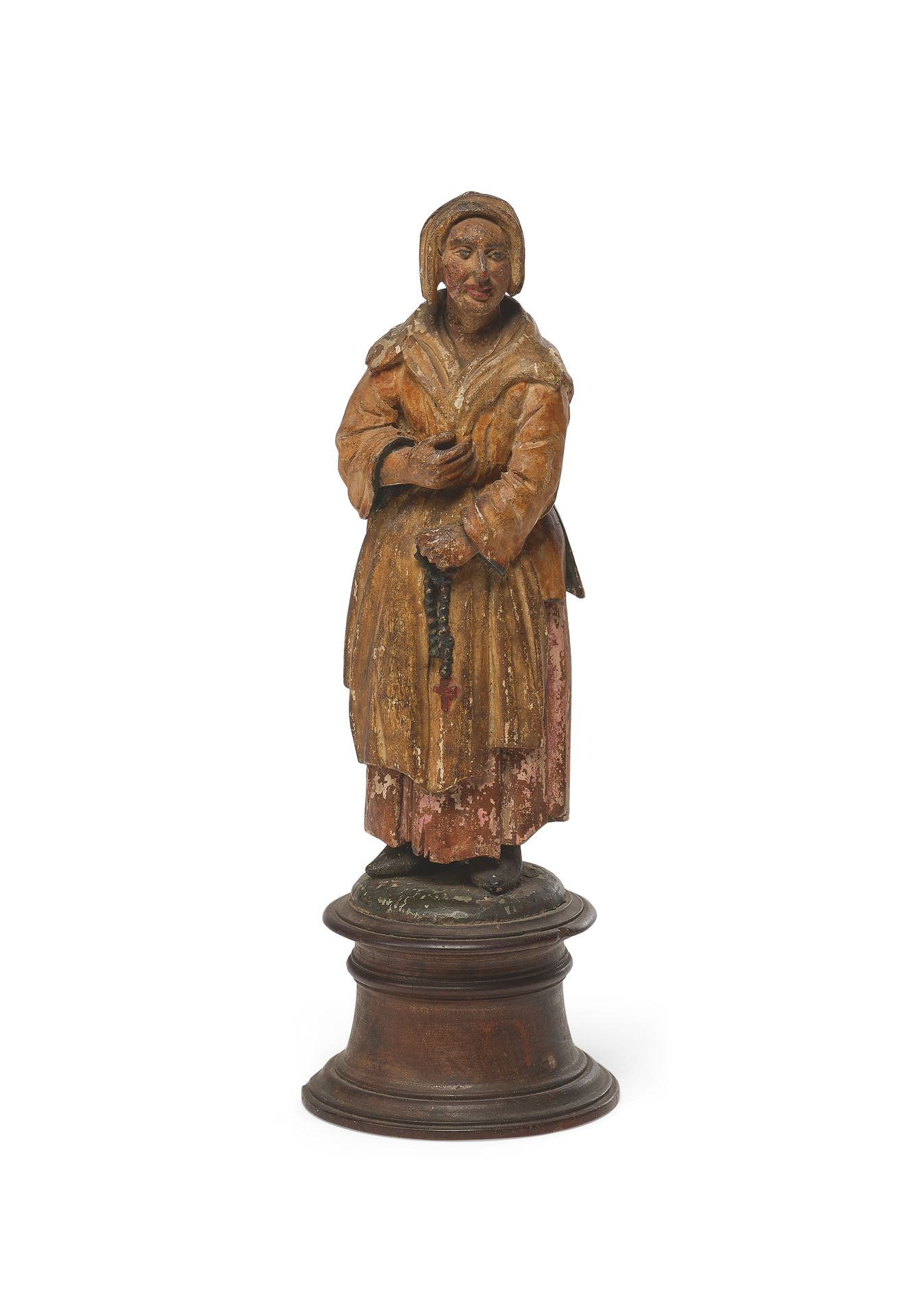 Null 雕刻和多色木雕的带肩章的猪头女人。流行作品，19世纪初。坐落在一个圆形的木质底座上。
总高度：19厘米（损坏和小块缺失）。