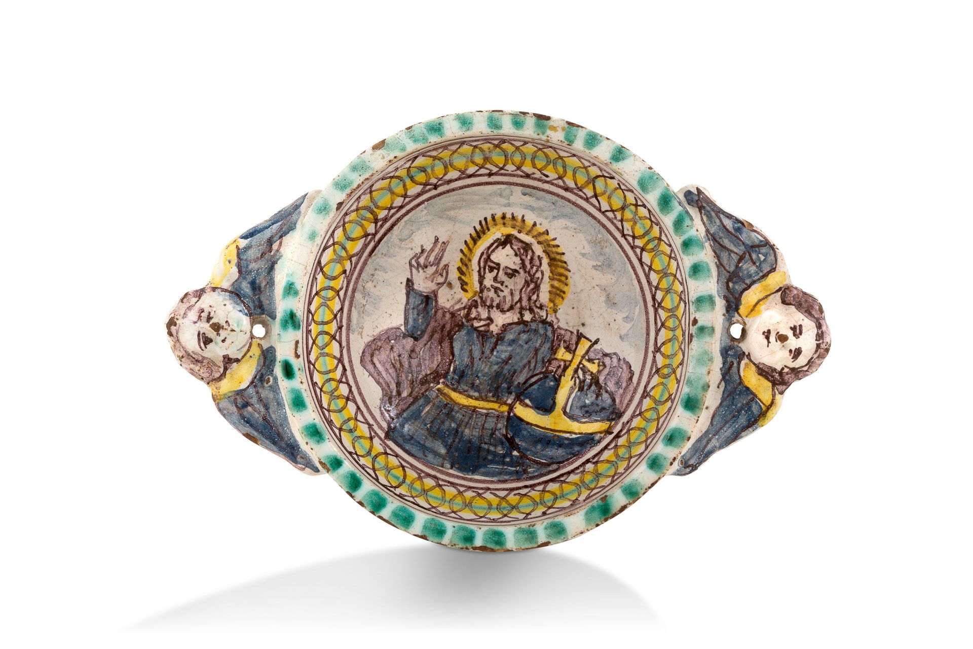 Null 白底黄、蓝、绿和锰多色装饰的小陶勺，救世主，耳朵是天使头的形式。18世纪。
高度：5厘米 - 长度：18.3厘米
(基座上有小缺口)