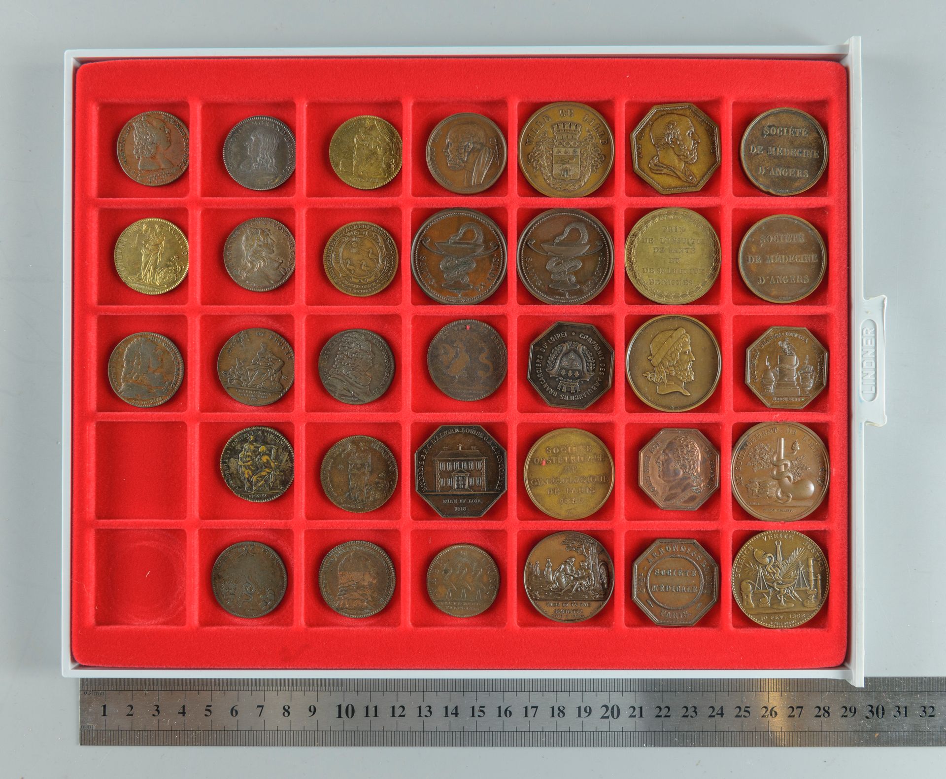 Null Medicine. Lot of 33 bronze tokens