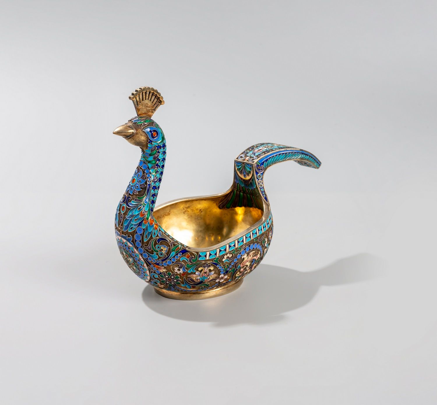 Null RUSSIA

A silver and cloisonné Kovsh, forming a peacock, decorated with var&hellip;