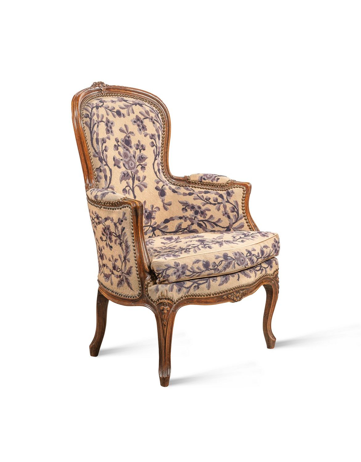 Null A cabriolet armchair in natural wood, moulded and carved with flowers. Curv&hellip;