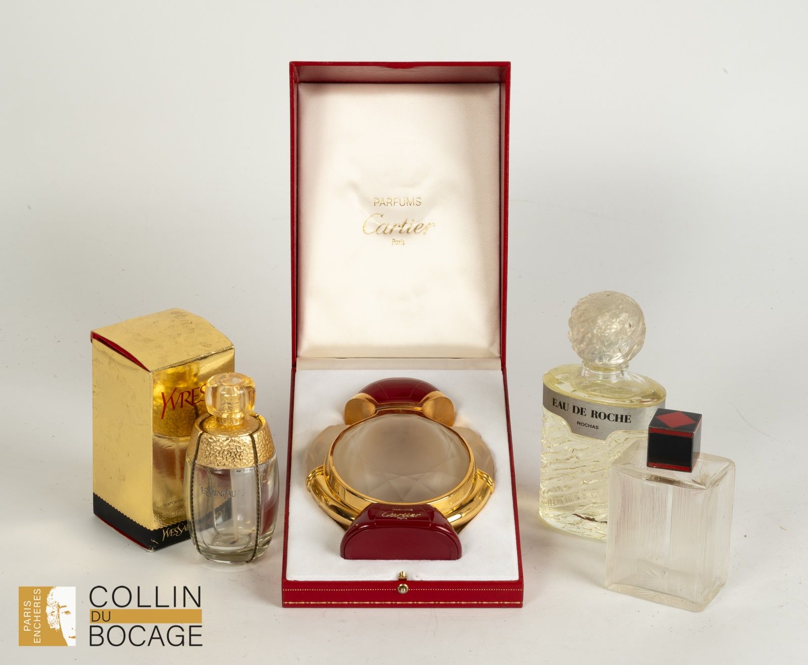 Null Lot de quatre flacons de parfum dont Cartier, Yvresse de Yves Saint Laurent