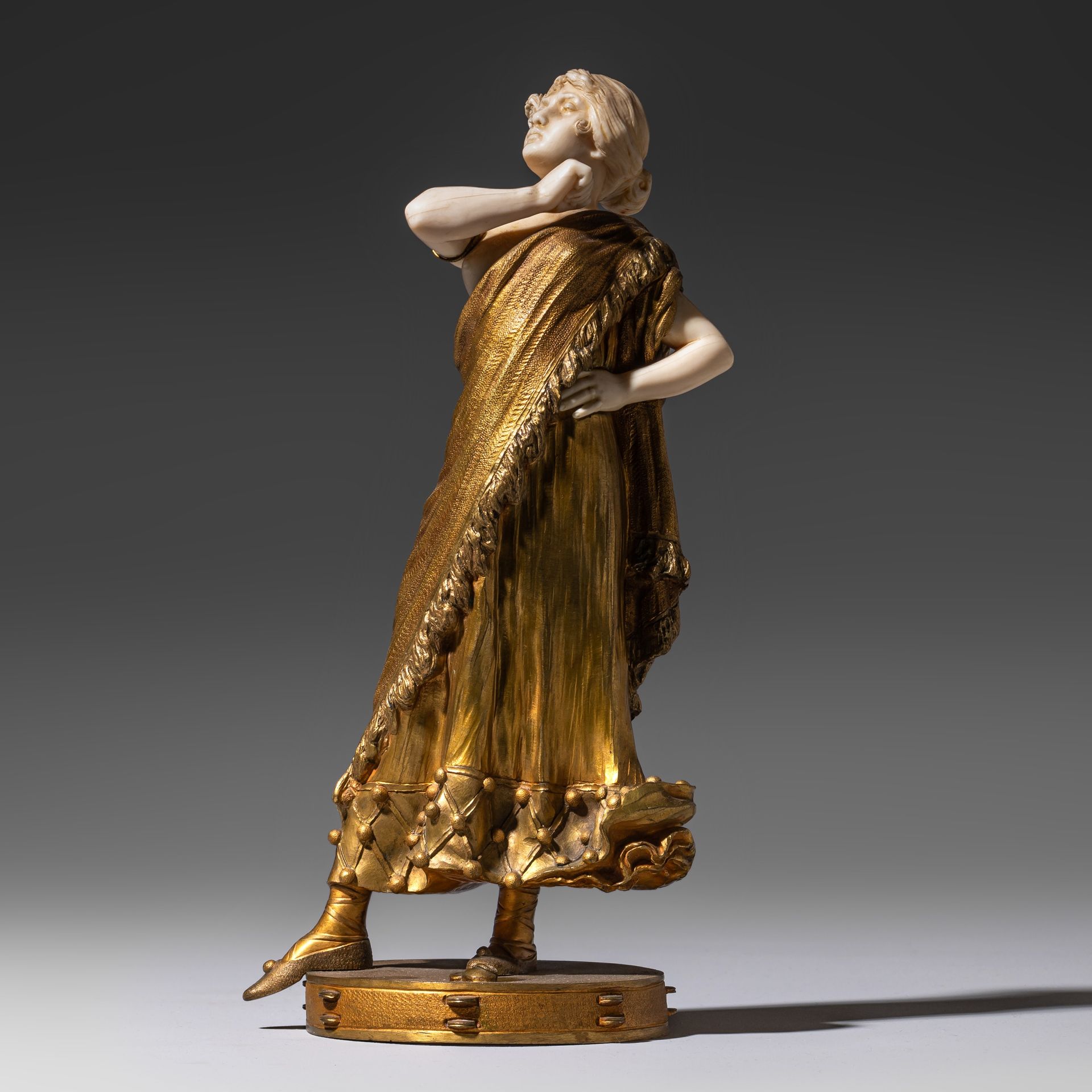 A chryselephantine sculpture of gilded bronze and ivory, 1910-1930, H 29 cm (+) &hellip;
