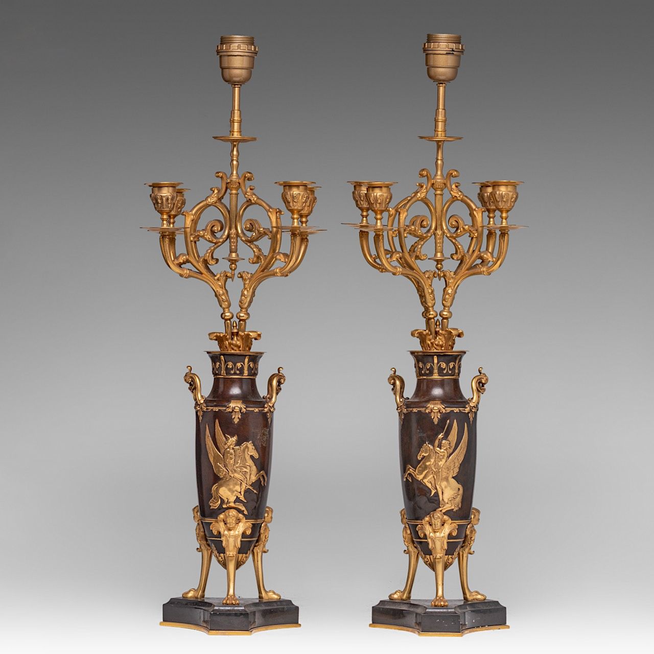 A pair of Empire style gilt and patinated bronze candelabras / lamps, H 66 cm A &hellip;