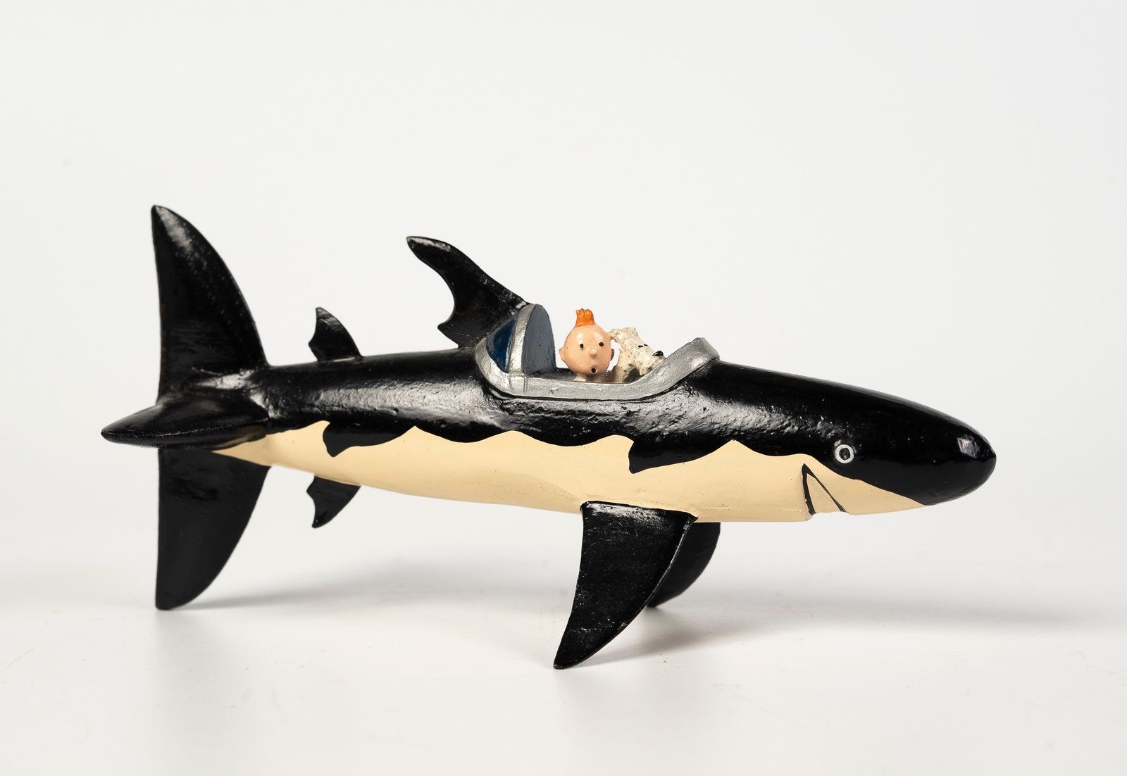 Null 红色拉克姆的宝藏


海格/皮克斯


Hergé :丁丁系列第2号


红色拉克姆的宝藏：丁丁和白雪在鲨鱼中--米色肚皮（1991年）。


参考资&hellip;