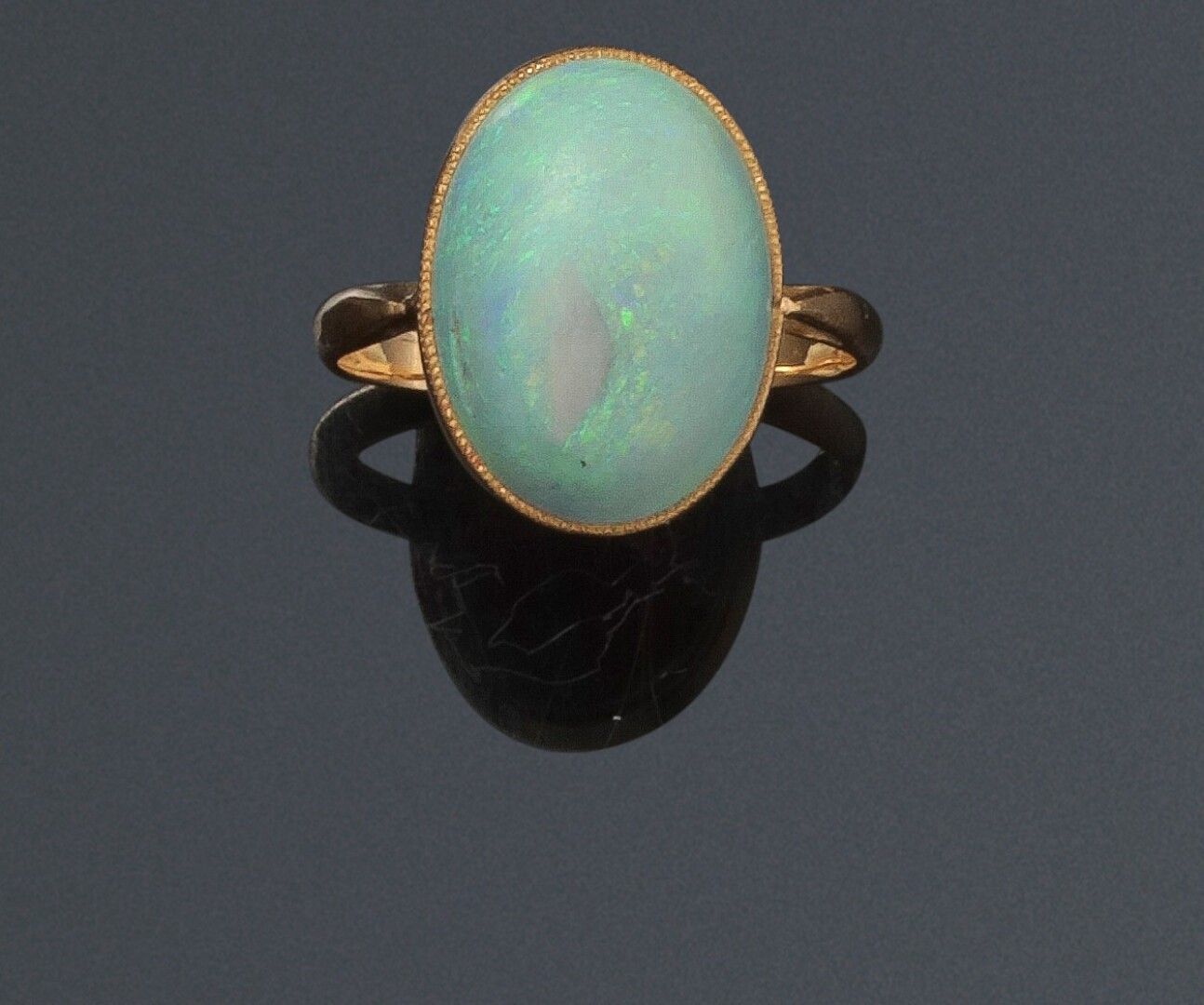 Null Ring set with an oval cabochon of opal (frosted), mounted in solitaire on y&hellip;