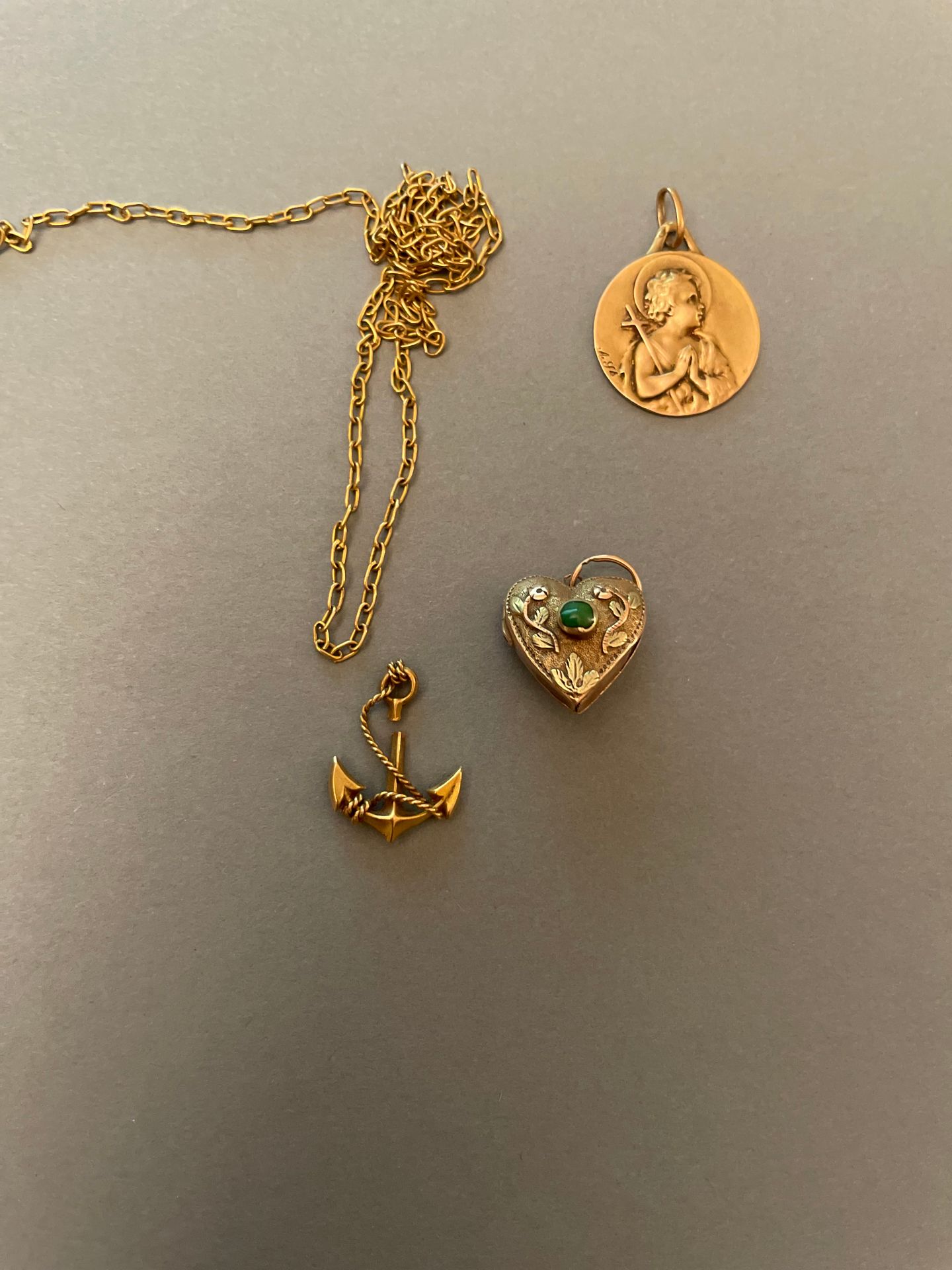 Null Gold heart-shaped reliquary pendant set with two gemstones, it contains a s&hellip;