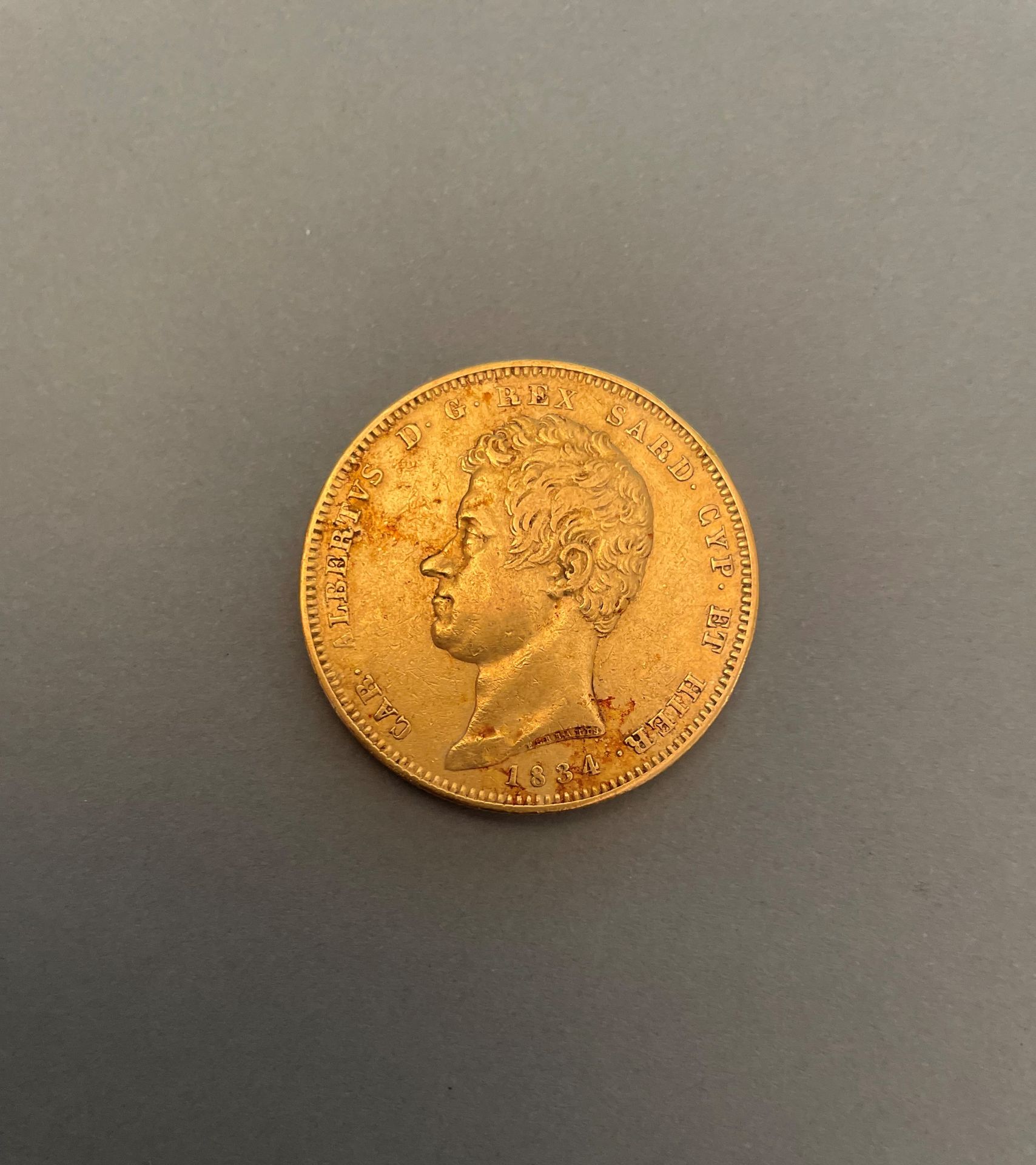 Null ITALY - 撒丁岛王国

100里拉金币，查尔斯-阿尔伯特，1834年。都灵

32,15 g

震动，磨损。