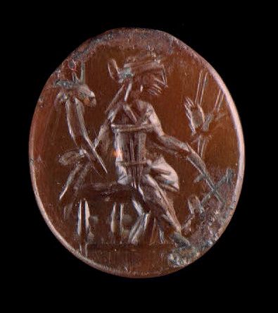 Null 扁椭圆形的凹版雕刻着一个坐着的Tyché-Fortuna。红玉髓。罗马艺术，2世纪。
1.6 x 1.4 cm
小碎片。