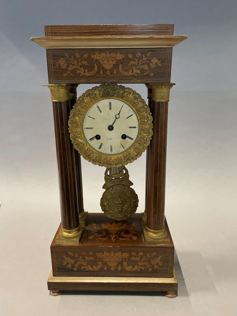 Null Portico clock in inlaid rosewood veneer.

Charles X period. 

52 x 26 x 15 &hellip;